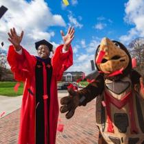 President Pines wearing a regalia with testudo. 