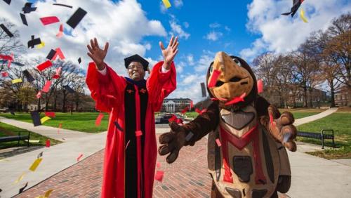 President Pines wearing a regalia with testudo. 