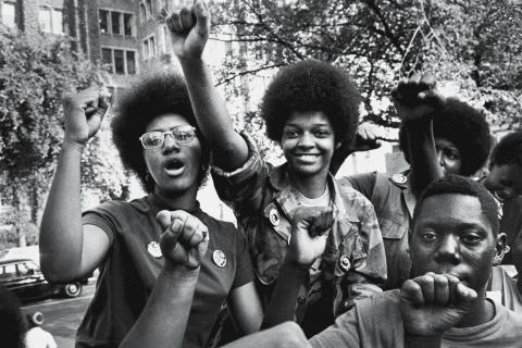Black power; Black activists in fros and fists up
